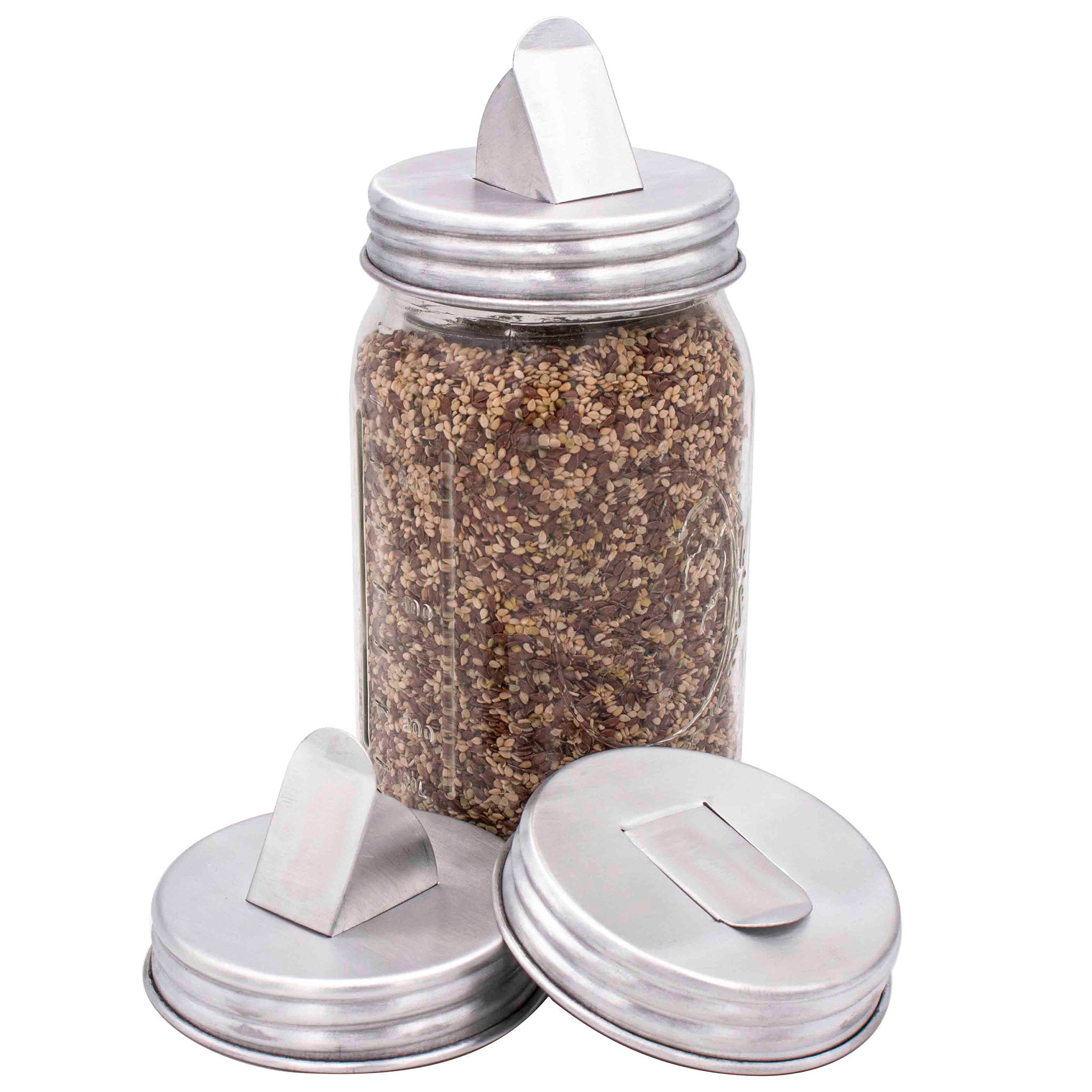 http://masonjarlifestyle.com/cdn/shop/files/mason-jar-lifestyle-wide-mouth-aluminum-grain-dispensing-lid-open-sesame-seeds-2.jpg?v=1698864803