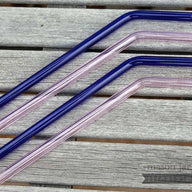 Two blue and two pink bent glass straws for pint Mason jars