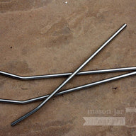 3 9.5" Stainless steel straws on flagstone