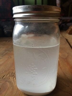 Nixtamalized corn lime water in Mason jar