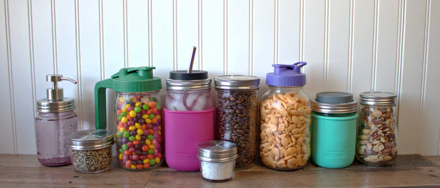 Mason jars with colorful lids, sleeves, snacks, and drinks