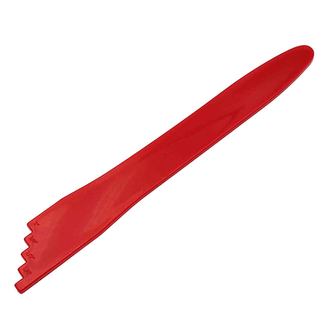 Bubble remover for canning, made of red plastic.