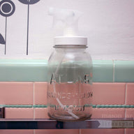 Adapta cap for regular mouth Mason jars in bathroom