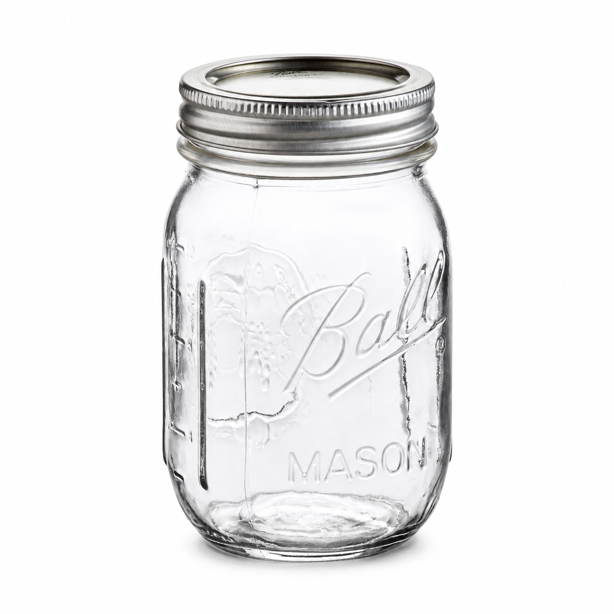 Ball 16oz regular mouth pint Mason jar with silver flat lid and band on a white background