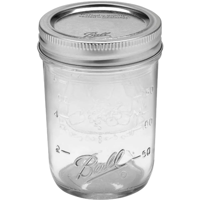 Ball 8oz regular mouth half pint Mason jar with silver lid and band on a white background