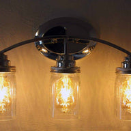 Light fixture with three quart open bottom Ball Mason jars, wide mouth lighting lids, and LED Edison bulbs
