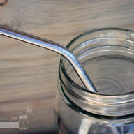 Close up of threading on thin bent stainless steel straws for pint Mason jars