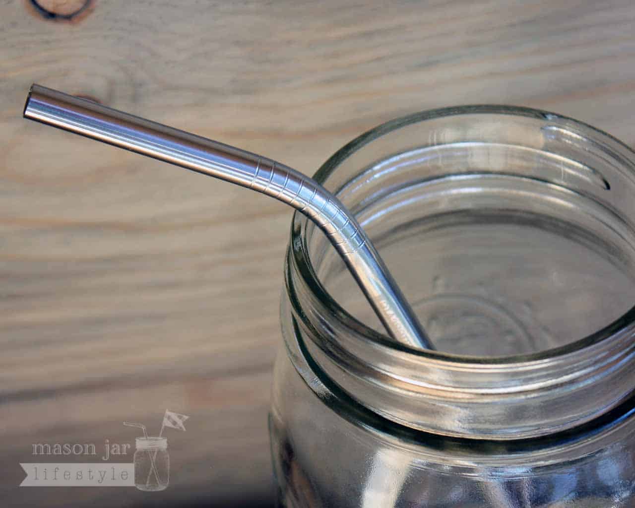 Close up of threading on thin bent stainless steel straws for pint Mason jars