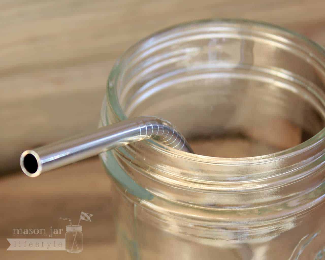 Close up of threading on short thin bent stainless steel straws for half pint Mason jars