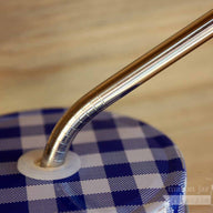Close up of threading on thin bent stainless steel straws for Mason jars