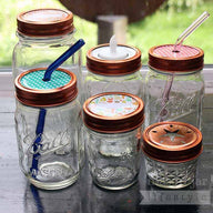 Copper rings / bands on six Ball Mason jars with different lid inserts