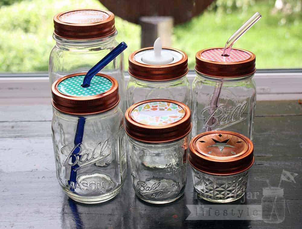 Copper rings / bands on six Ball Mason jars with different lid inserts