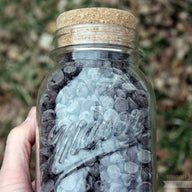 Cork lid stopper on regular mouth quart Mason jar with chocolate chips