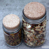 Cork lids stoppers on regular and wide mouth Mason jars with nuts