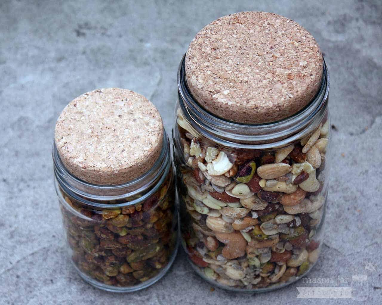 Cork lids stoppers on regular and wide mouth Mason jars with nuts