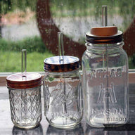Thick glass smoothie straws in half pint, pint, and quart Ball Mason jars with lids