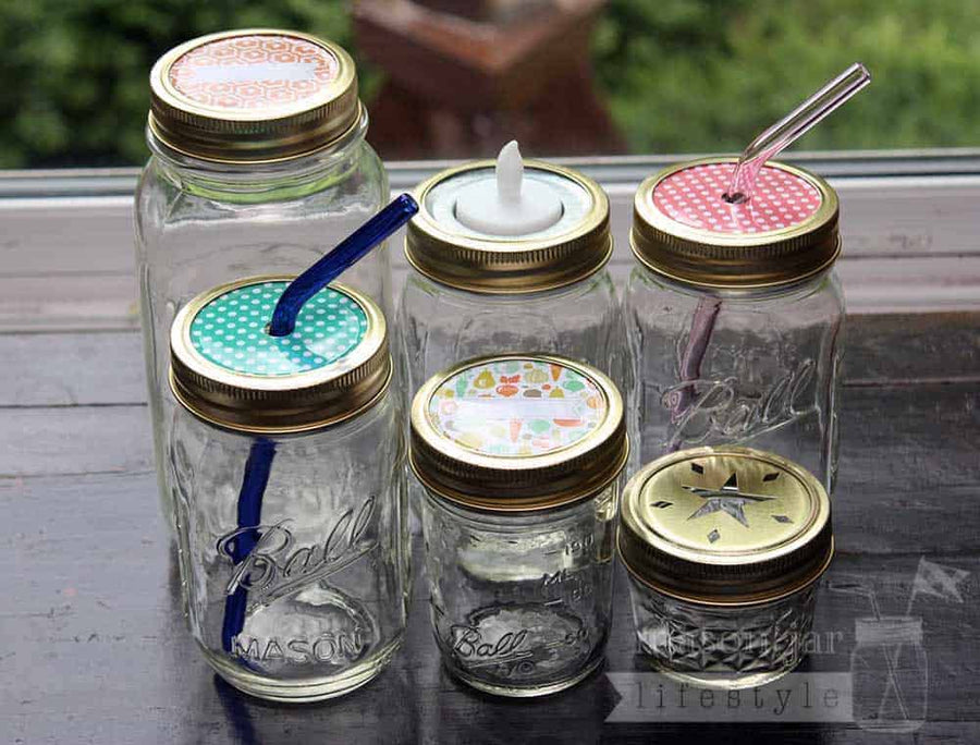 Gold rings / bands on six Ball Mason jars with different lid inserts