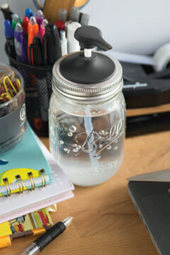 Jarware black plastic soap pump for regular mouth Mason jars on desk