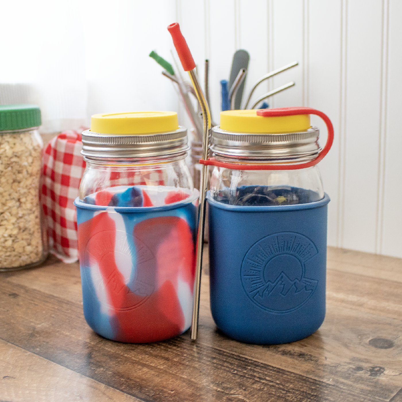 A Mason jar quarts with lids, straw, straw strap, and the 150 anniversary sleeve design.