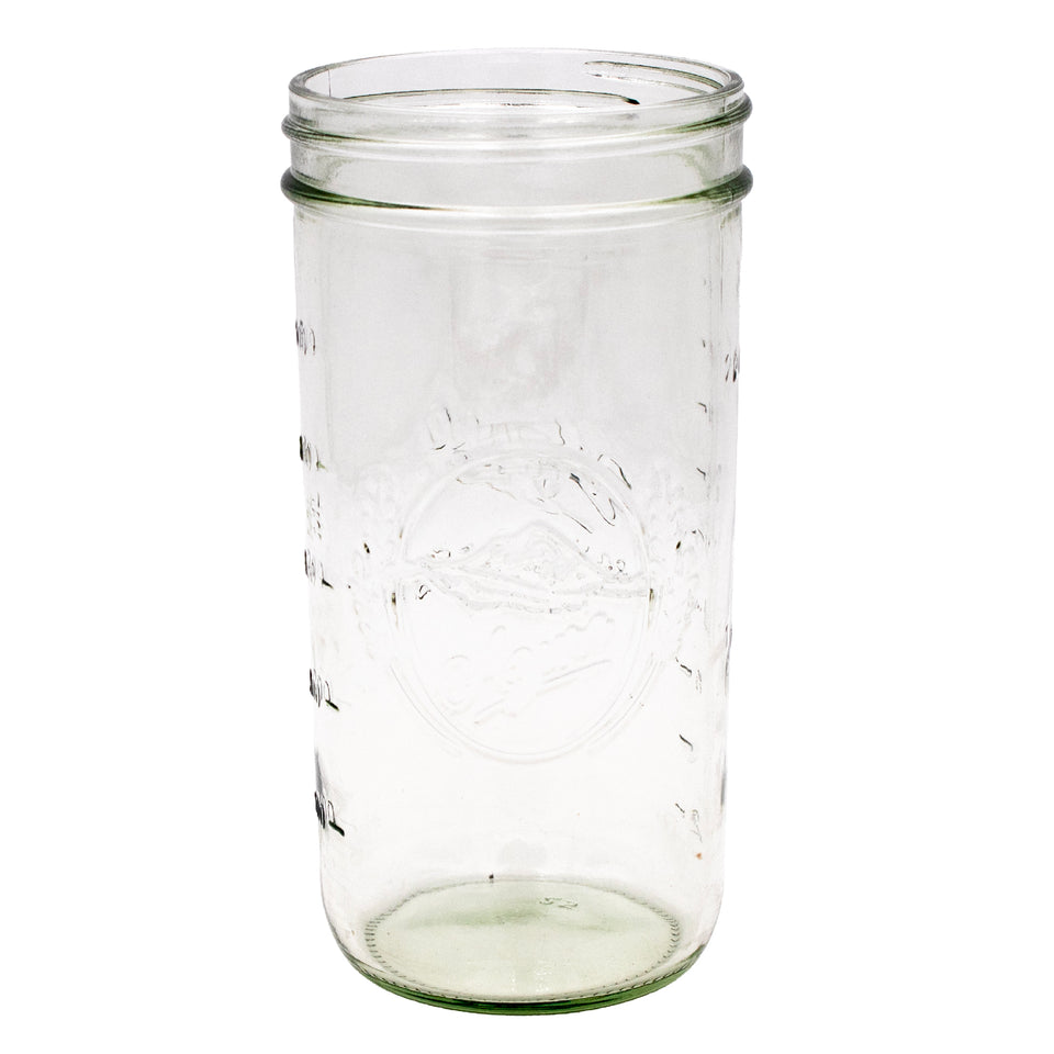 Azure Standard Mason 24oz wide mouth jar, showing off the debossed Azure logo. The logo is a simple mountain in an oval, with pieces of wheat framing it.