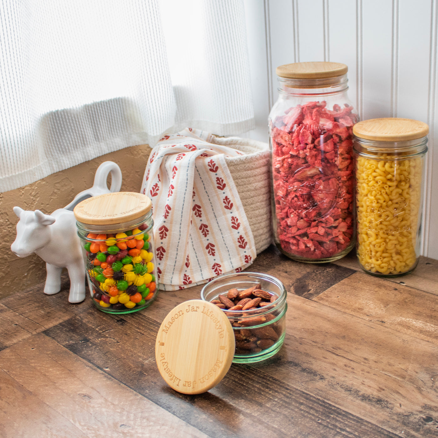 All sorts of dry snacks in Mason jars, with bamboo storage lids in them.