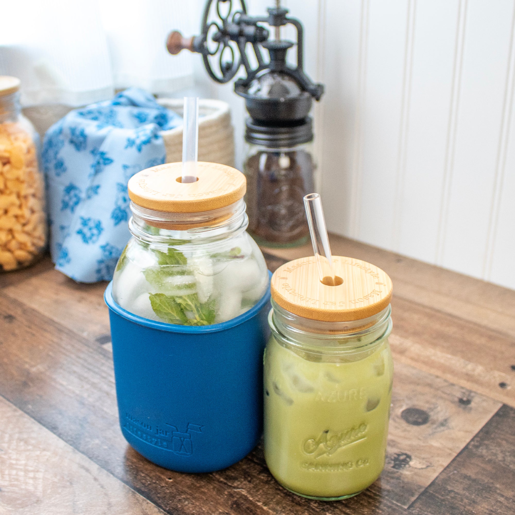 Regular mouth bamboo straw lids on Mason jar, pint and quart.