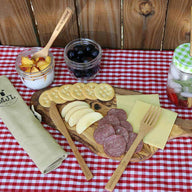mason-jar-lifestyle-bamboo-utensil-set-roll-up-cotton-carrying-bag-fork-knife-straw-pint-jar-gingham-lid-cutting-board-cheese-apples-salami-crackers