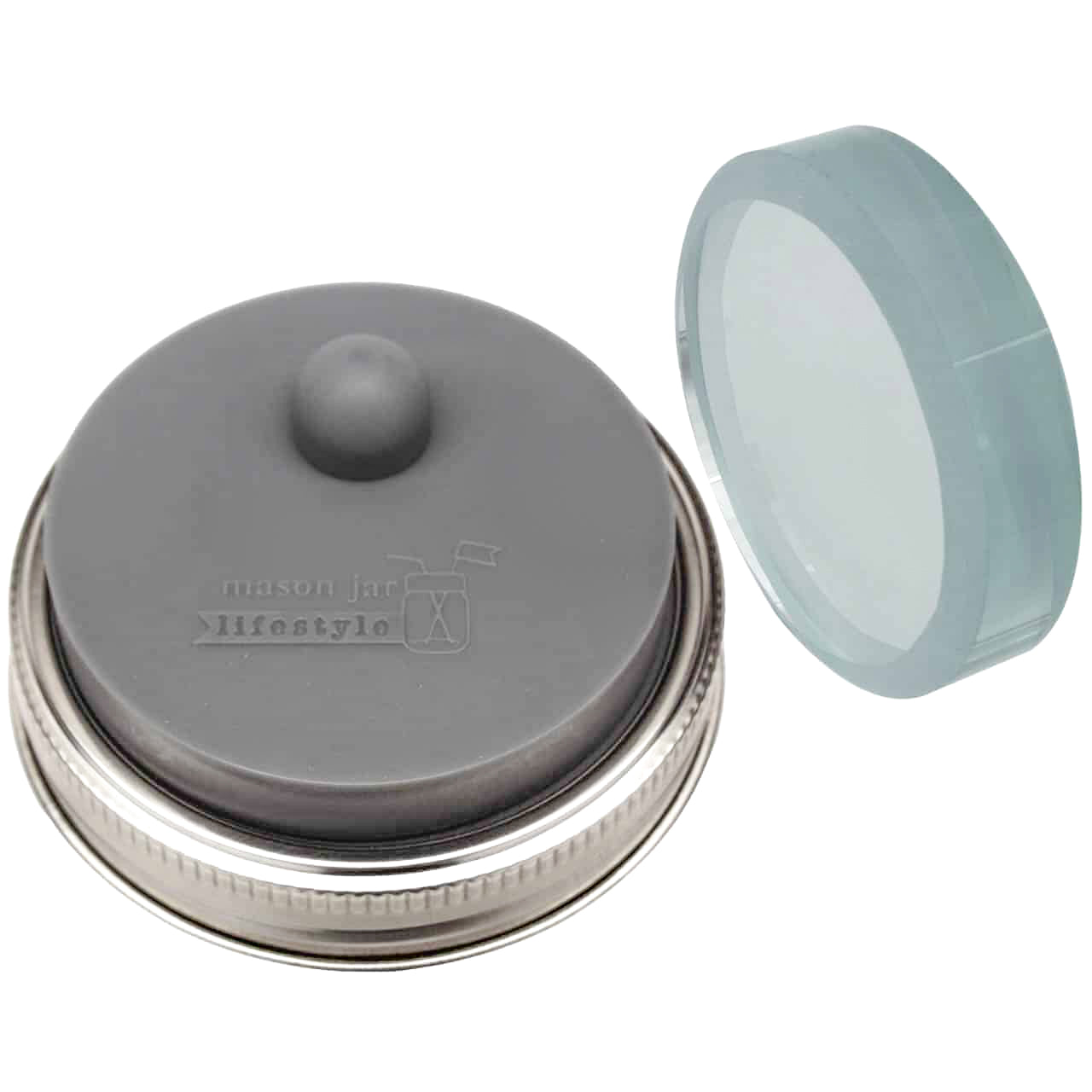 Up close on a fermentation weight, which has a raised design that says "Mason Jar Lifestyle".