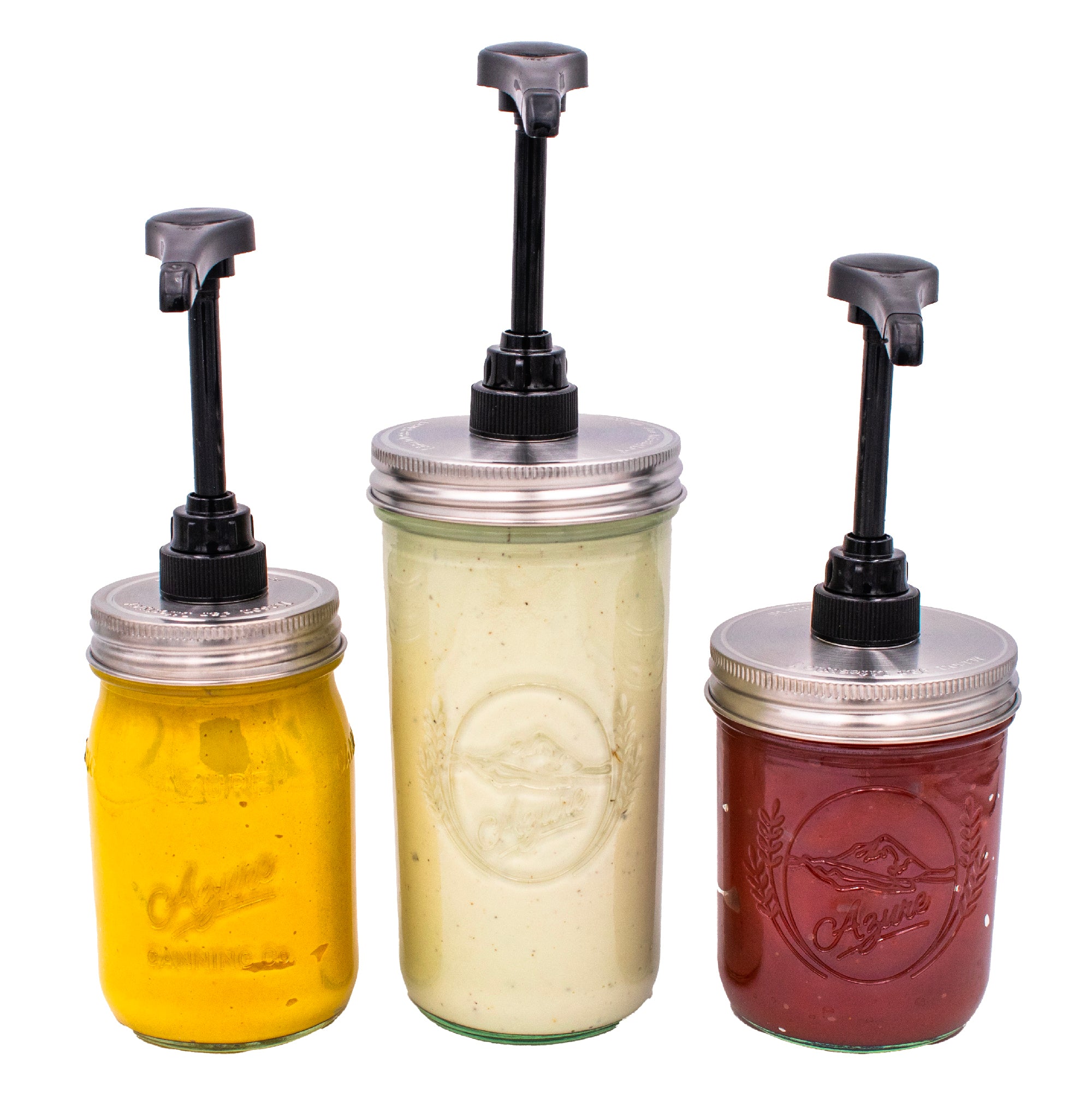 3 Mason jars, each with a black plastic food grade pump and stainless steel lid, containing mustard, ranch, and ketchup.