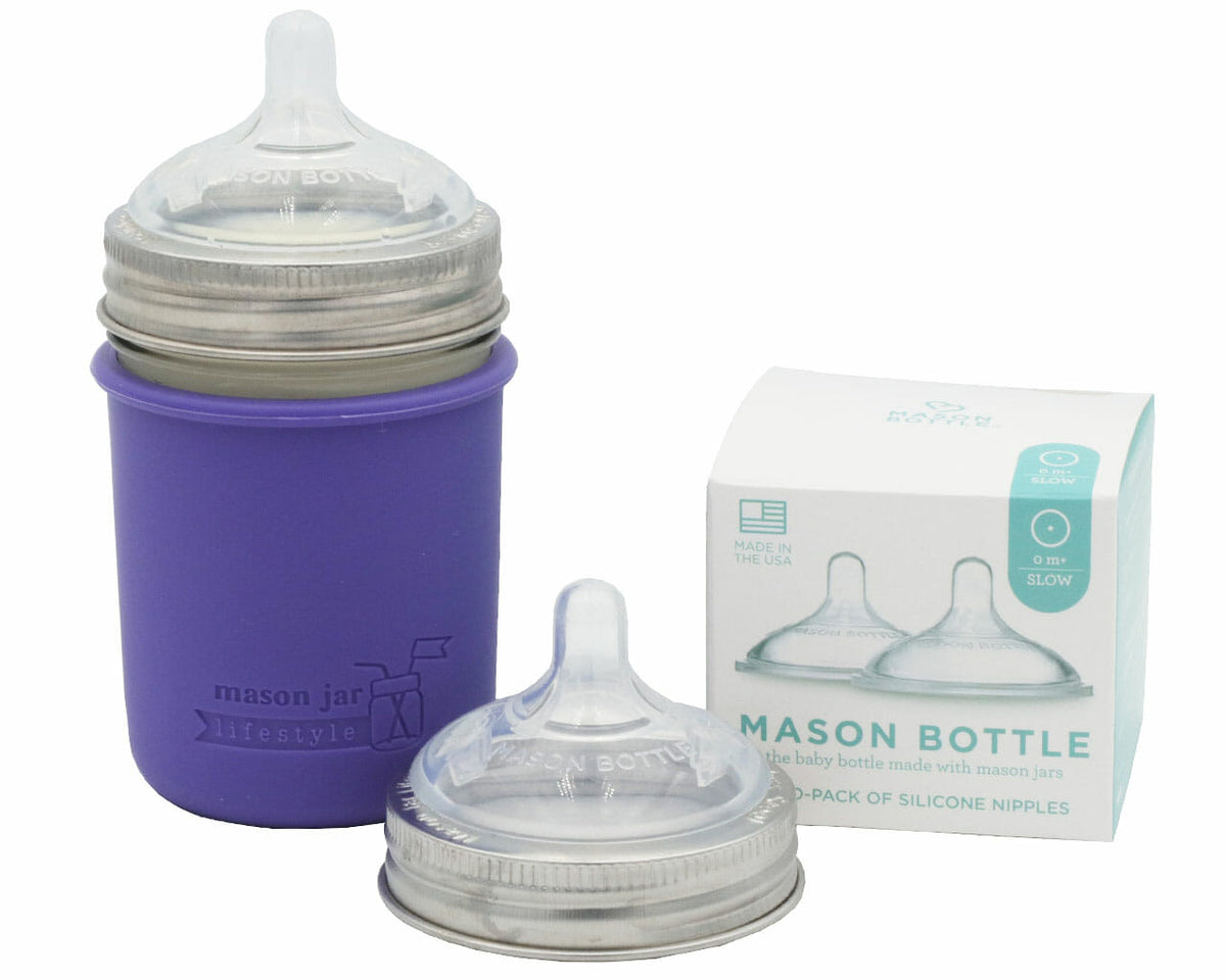 Two Mason Bottle silicone nipples with stainless steel bands, one shown on a jar with a purple sleeve; jar and sleeve not included
