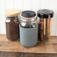 The same sleeve with coffee grounds and cigars in the background.