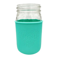 The "Mom's Flowers" design engraved into a aquamarine quart Mason jar sleeve.