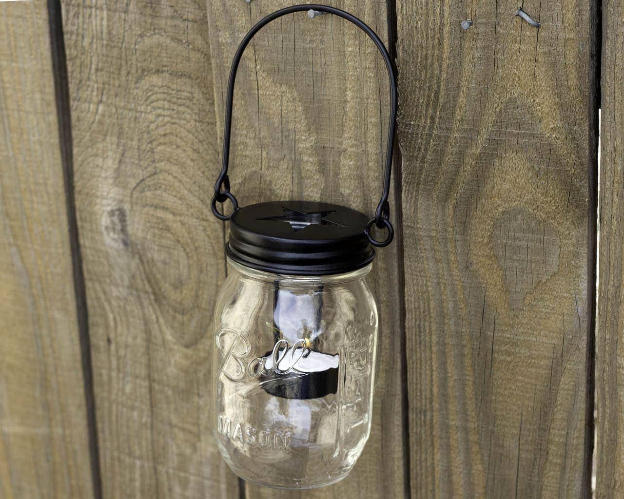 mason-jar-lifestyle-matte-black-primitive-tea-light-candle-holder-star-handle-up-hanging-regular-mouth-mason-jar-fence