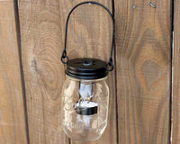 mason-jar-lifestyle-matte-black-primitive-tea-light-candle-holder-star-handle-up-hanging-regular-mouth-mason-jar-fence