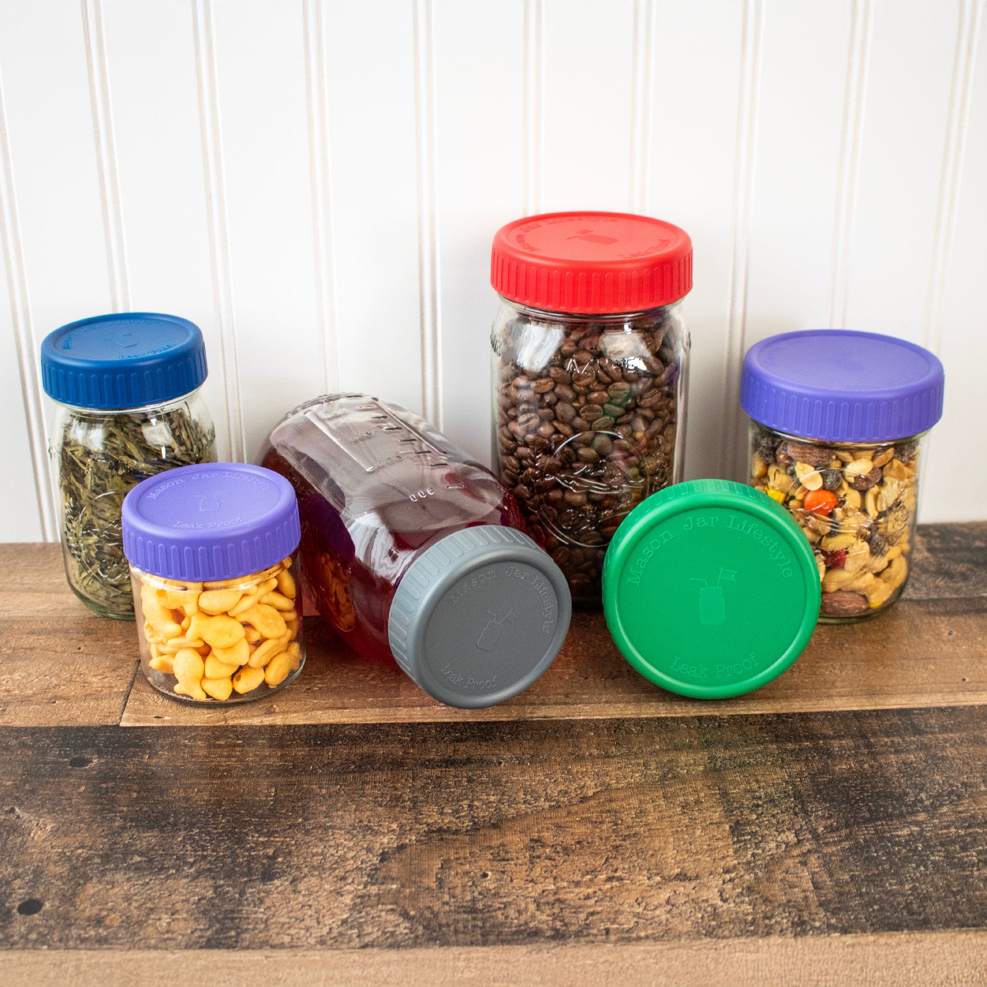 Plastic storage lids on different sized Mason jars, 16oz and 32oz.