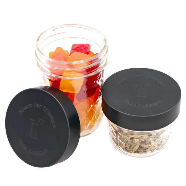 Child resistant stainless steel lids, on a regular mouth Mason jar.