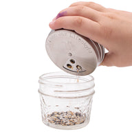 https://masonjarlifestyle.com/cdn/shop/files/mason-jar-lifestyle-regular-mouth-stainless-steel-spice-shaker-lid-large-three-hole-seed-mix-in-use.jpg?crop=center&height=192&v=1695767528&width=192