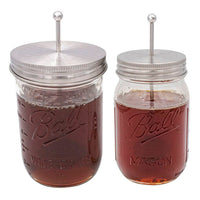 Stainless steel honey dipper lids for Mason jars, on a regular and wide mouth pint Mason jar.
