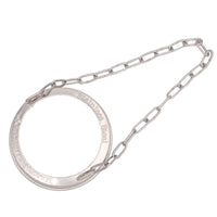 A regular mouth stainless steel band on white background from above, show that there is raised letters around the edge that say "Stainless Steel" and "Mason Jar Lifestyle".