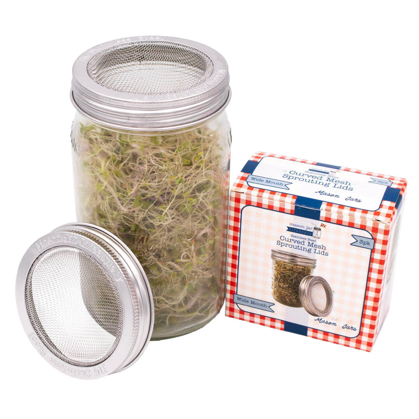 3 pack wide mouth boxed packaging next to a wide mouth quart Mason jar with the same lid on it.