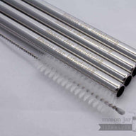 Four stainless steel straws with safer rounded ends and cleaning brush