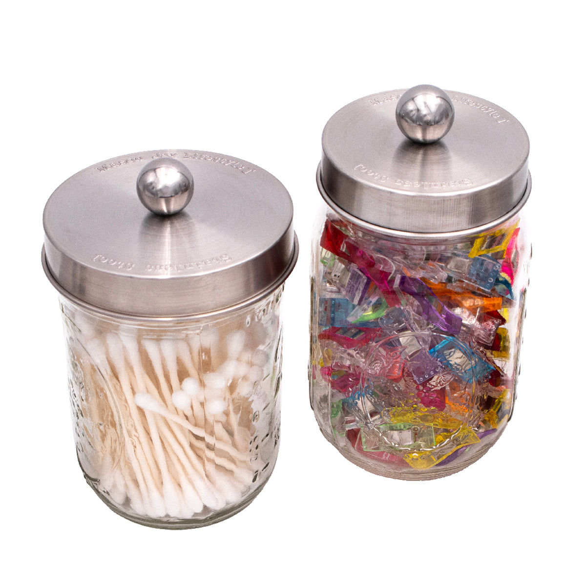 Stainless steel apothecary lids on regular mouth and wide mouth Mason jars.