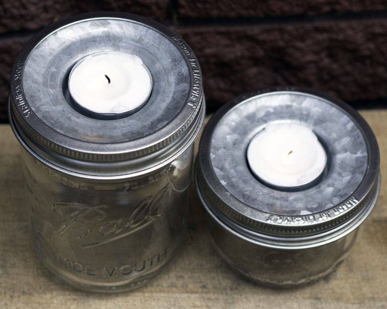 mason-jar-lifestyle-tea-light-holder-lid-insert-wide-mouth-half-pint-kerr-ball-jar-stainless-steel-bands-red-brick-top