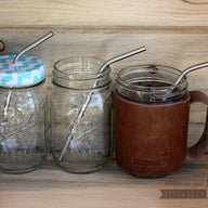 Medium thin bent stainless steel metal straws in three pint Mason jar