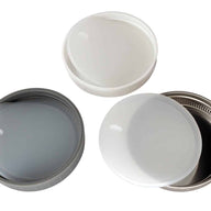 Platinum silicone lid liners with tabs in three different types of wide mouth lids. Leak proof and air tight. Use with a band as a lid, or as a liner inside other lids.