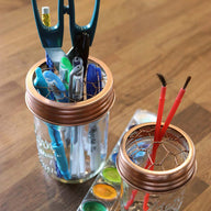 Shiny copper frog / flower / desk organizer lids for regular and wide mouth Mason jars with pens, paintbrushes, and scissors