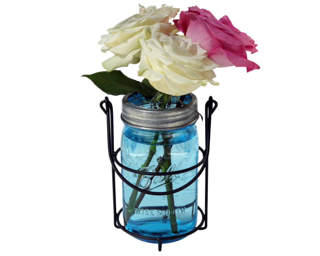One jar caddy for hanging quart 32oz Mason jars with blue Ball jar, galvanized flower frog lid, and roses