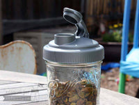 reCAP pour spout lid on wide mouth pint Ball Mason jar with pistachios