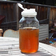 reCAP white pour spout lid on half gallon wide mouth Mason jar with tea