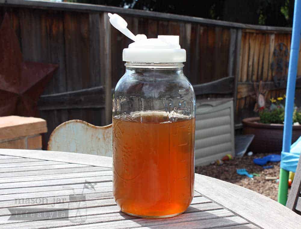 reCAP white pour spout lid on half gallon wide mouth Mason jar with tea